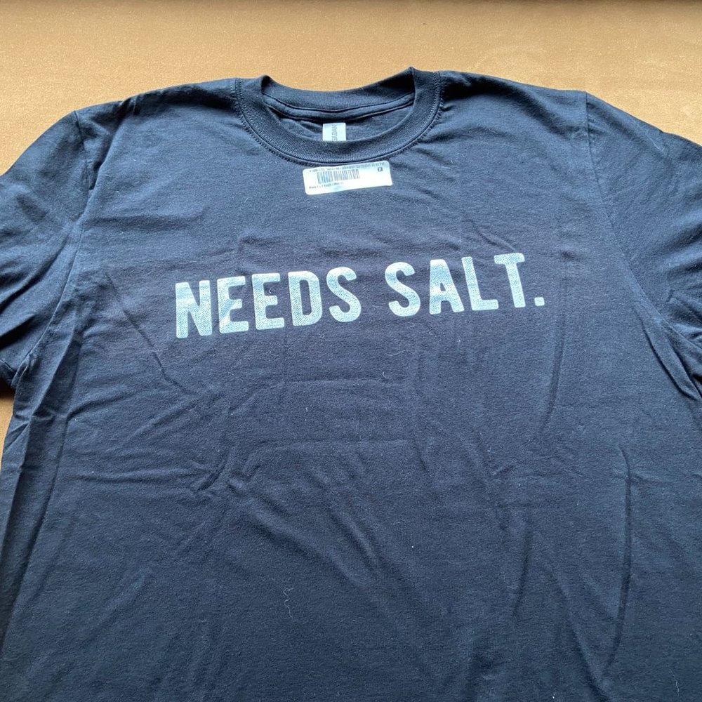 Black Unisex T-shirt.  Men's large, but runs very small.